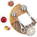 Shiny stainless steel meatball maker tongs with ball-shaped scoop and handles for kitchen use