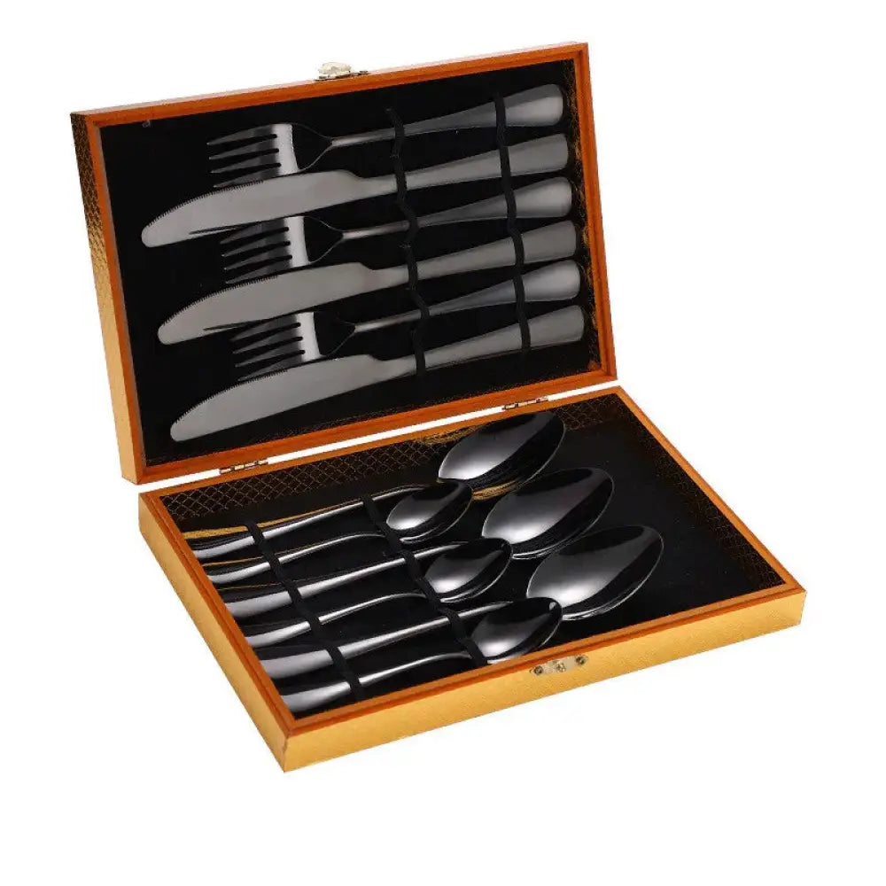 Premium stainless steel steak cutlery set with black finish in a wooden presentation box for elegant dining