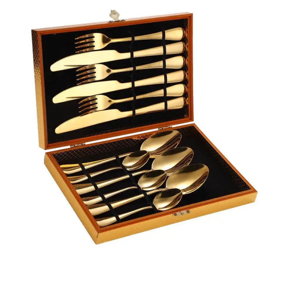 Premium stainless steel steak cutlery set with gold finish in a wooden presentation box for elegant dining