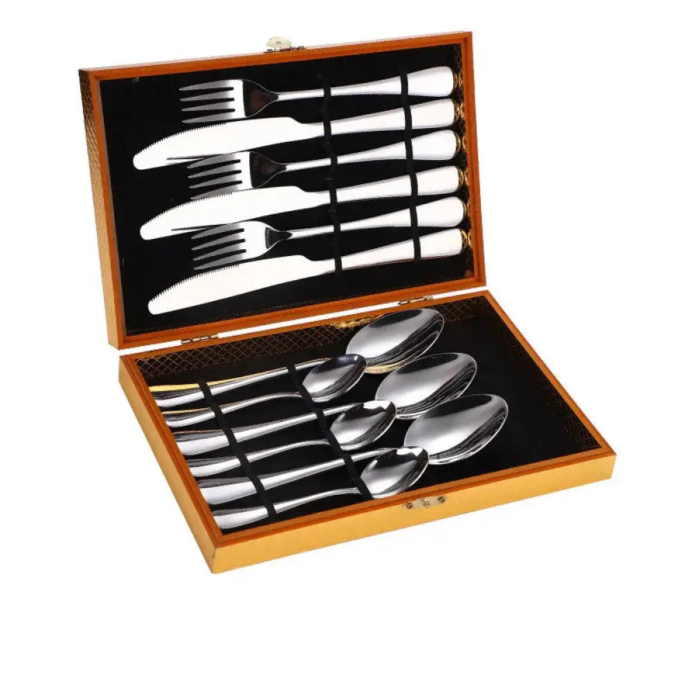 Premium stainless steel steak cutlery set in silver with a wooden presentation box for elegant dining