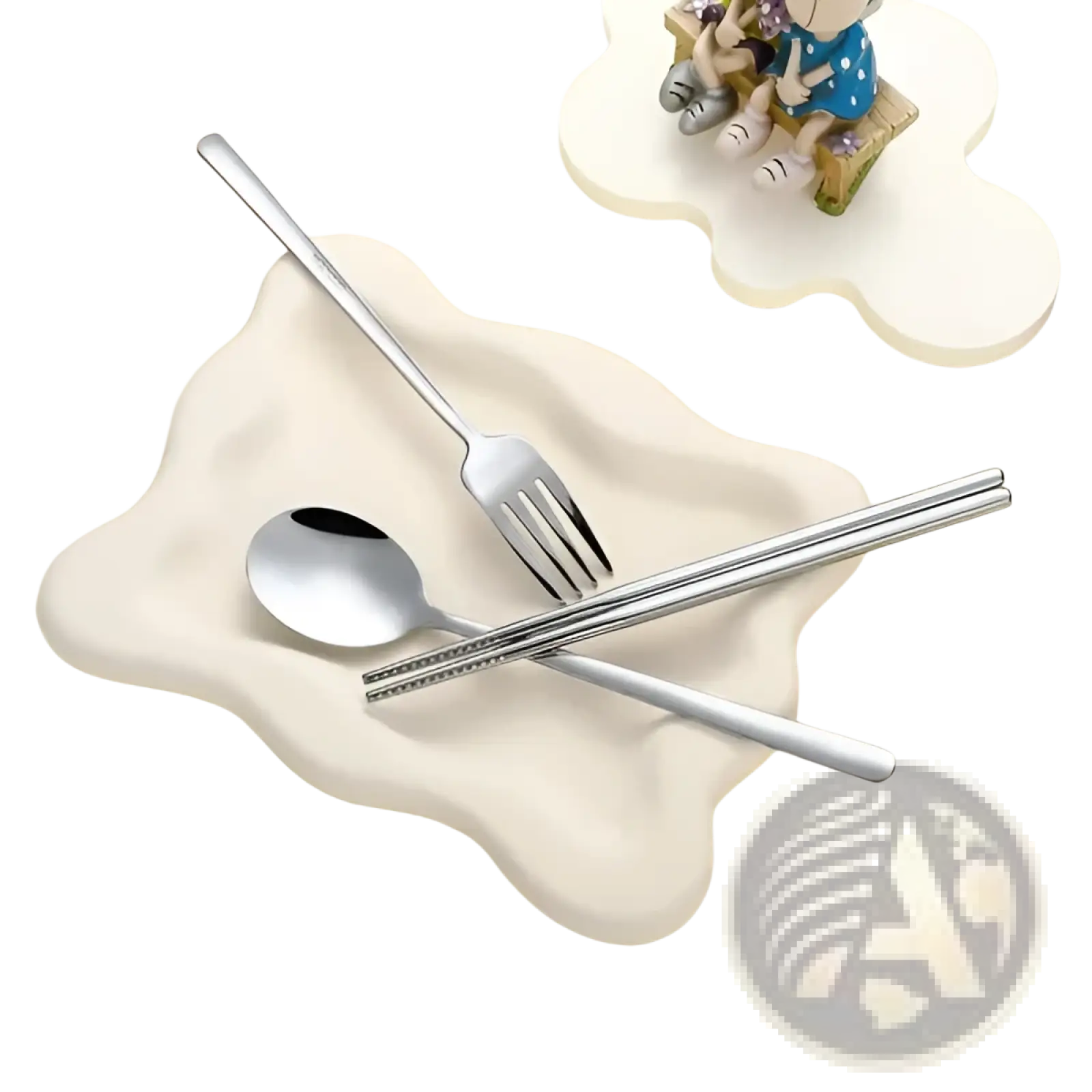 Silver stainless steel travel cutlery set with spoon fork and chopsticks on off-white ceramic bear-shaped dish