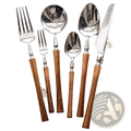 Set of stainless steel wooden handle cutlery with polished steel heads and warm natural wood handles for dining
