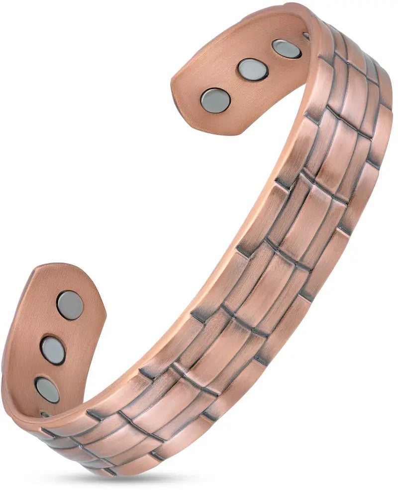 Stamped chain magnetic copper bracelet with a brick-like texture and three circular magnets on each end for targeted relief