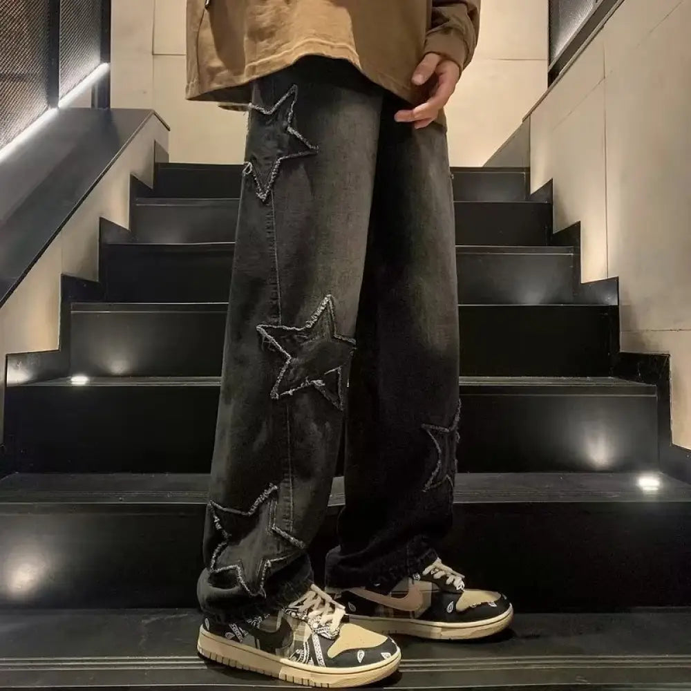 Black denim men’s y2k star applique baggy streetwear jeans with distressed star patches and frayed edges