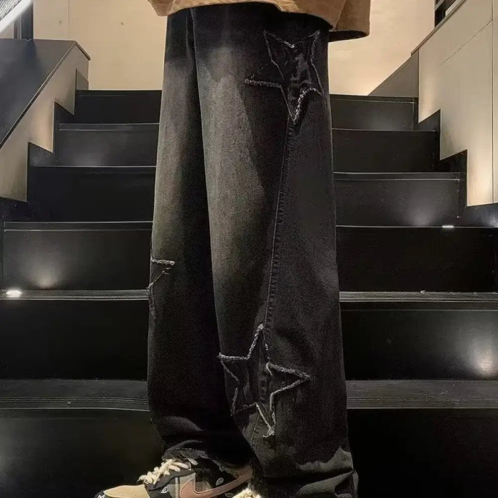 Men’s y2k black denim baggy streetwear jeans with distressed star-shaped embroidery along the outer leg