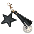 Star leather tassel keychain for women featuring a black star-shaped leather piece with gold-tone clasp and tassel