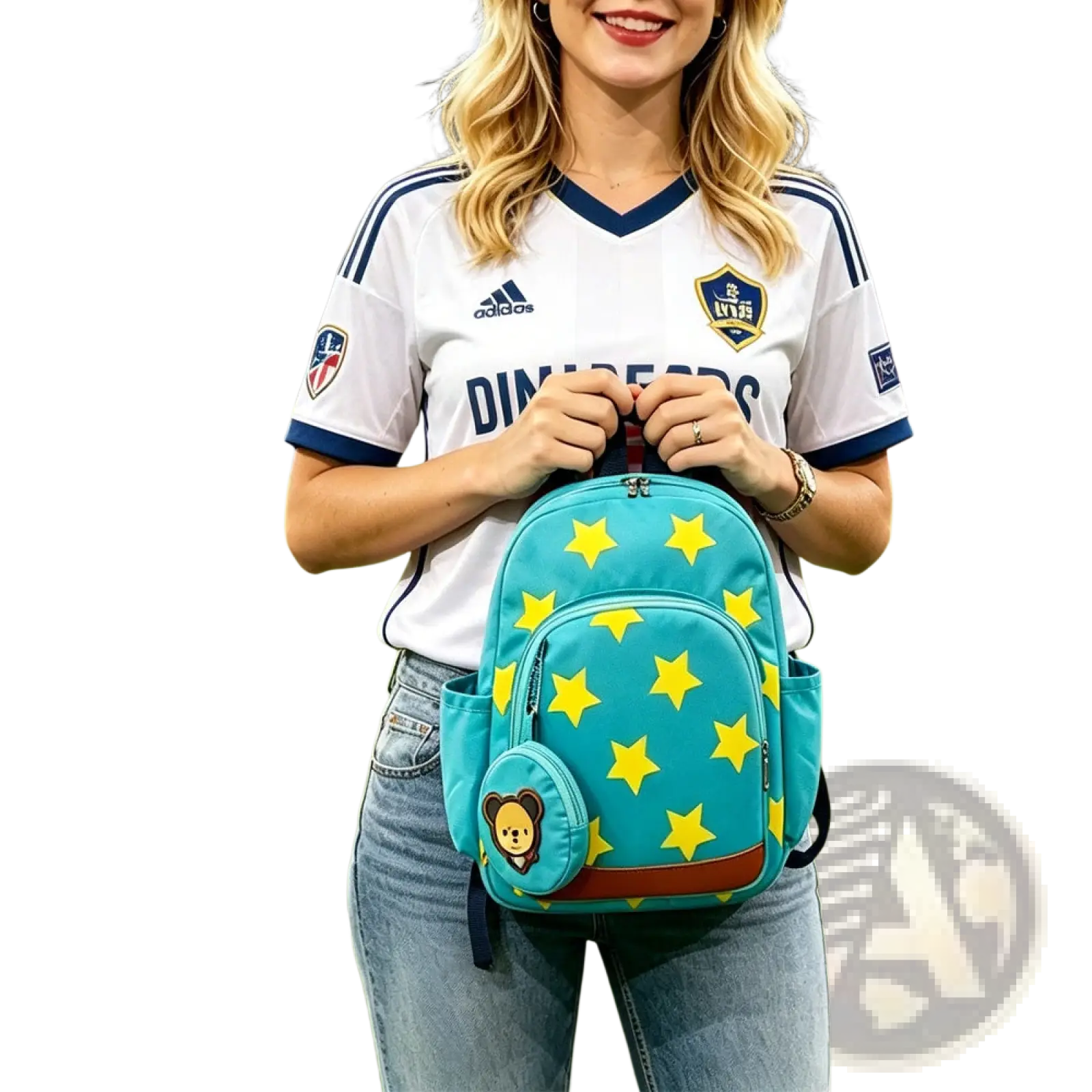 Teal star print soccer backpack with yellow star pattern and attached teddy bear coin purse charm