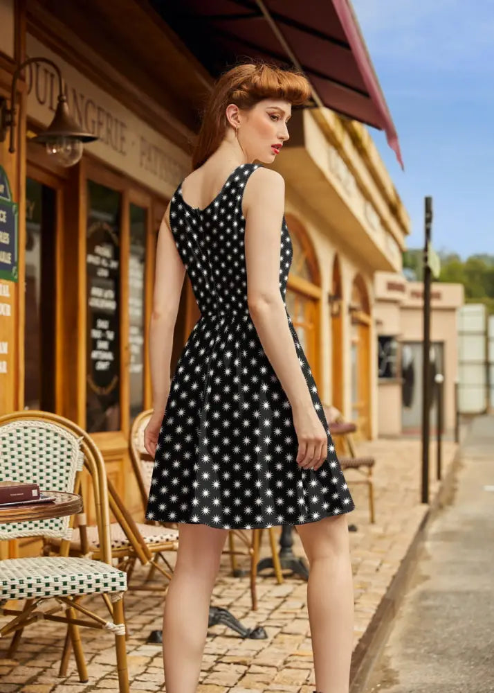 Starburst retro cotton fit and flare dress with pockets in black sleeveless a-line design with white polka dots