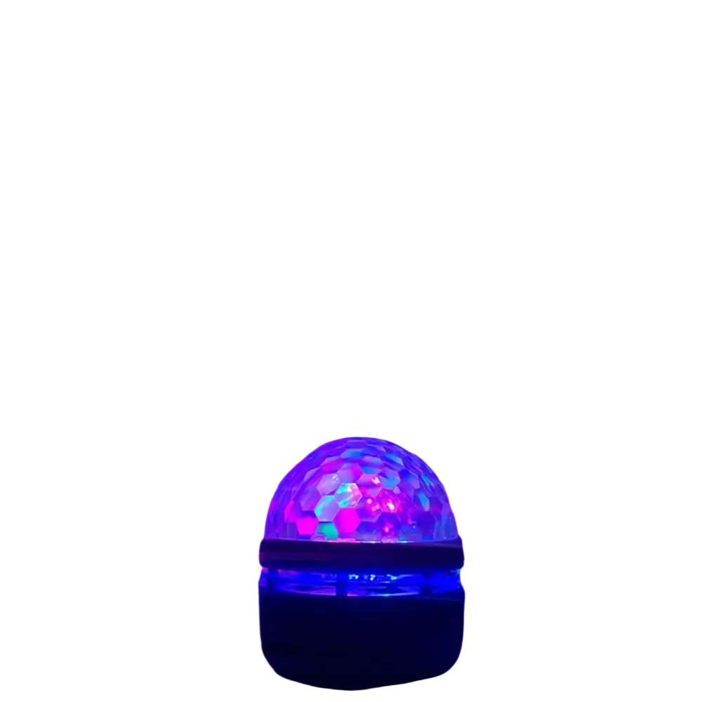 Starry sky projection light night light with faceted transparent dome emitting vibrant blue and purple rays