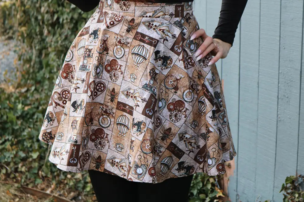 Vintage sepia steampunk flared skater skirt in small featuring bicycles hot air balloons and gears on beige fabric