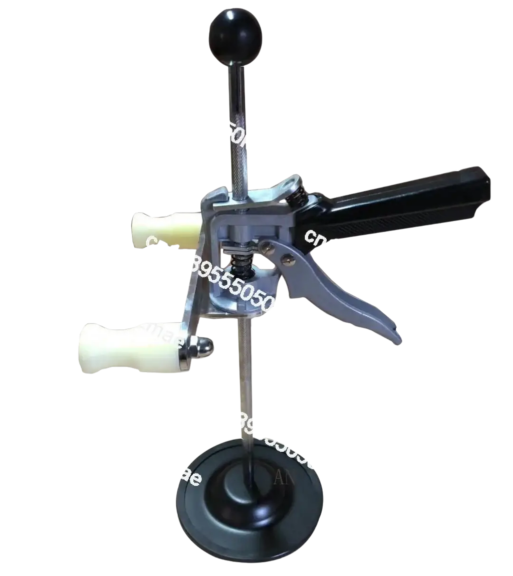 Black and silver metal steering wheel holder with black handle and white grips for 3d four-wheel aligner