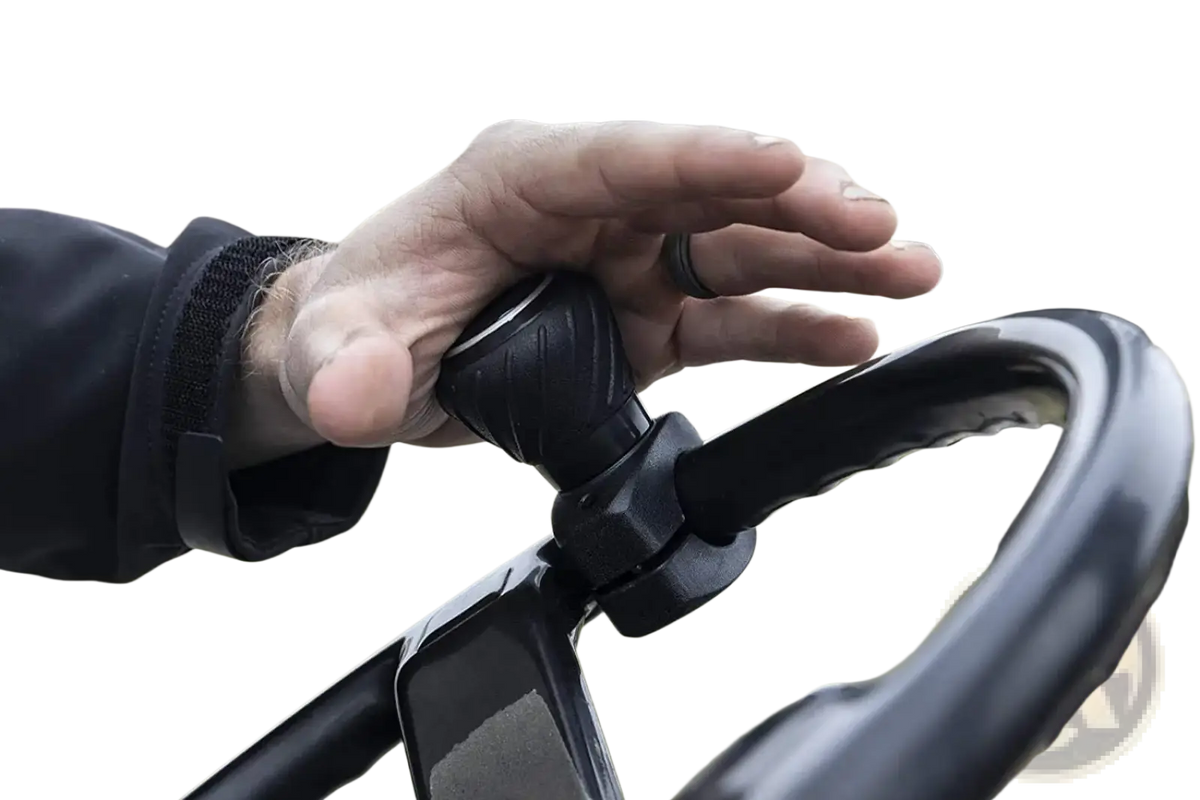Black rubberized steering wheel spinner knob with textured surface and ergonomic grip for comfortable control