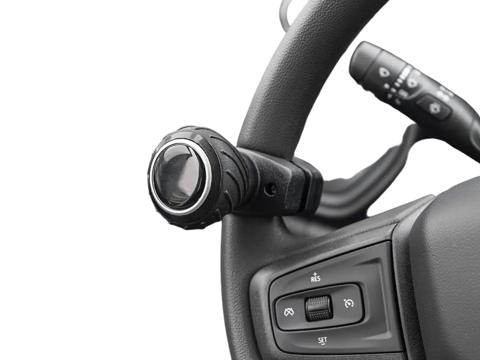 Black textured steering wheel spinner knob with silver metallic ring and ergonomic grip for improved handling