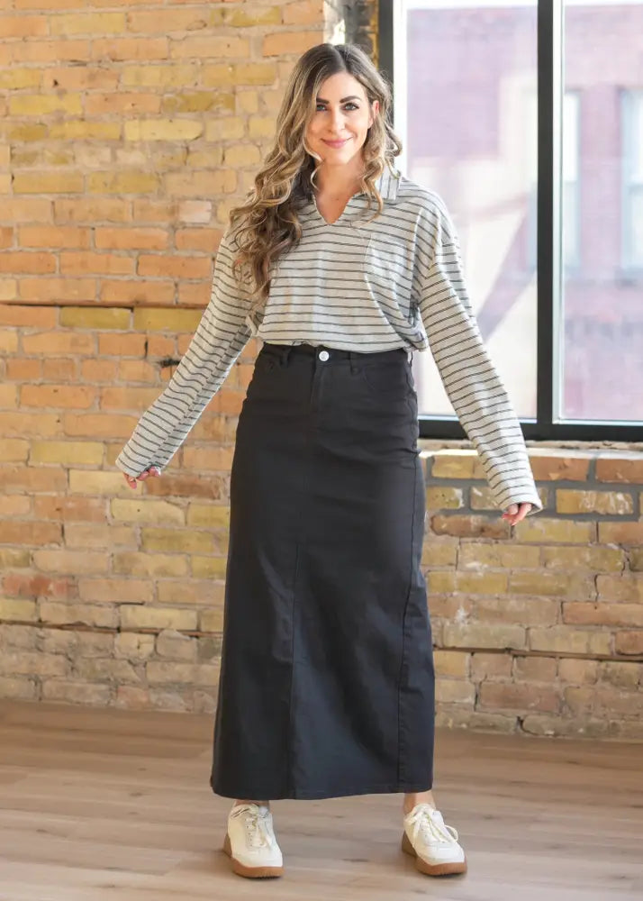 Stella onyx black high waisted denim maxi skirt with smooth straight cut silhouette and subtle side seam detailing