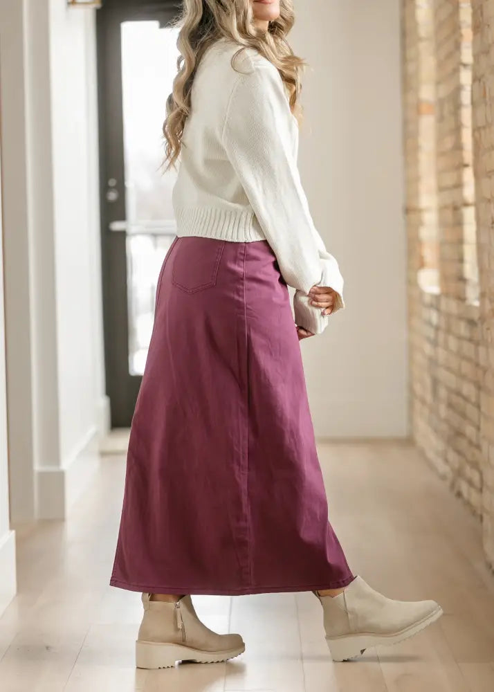 A flowing deep purple Stella Orchid high waisted midi skirt in denim with a straight cut and front pockets