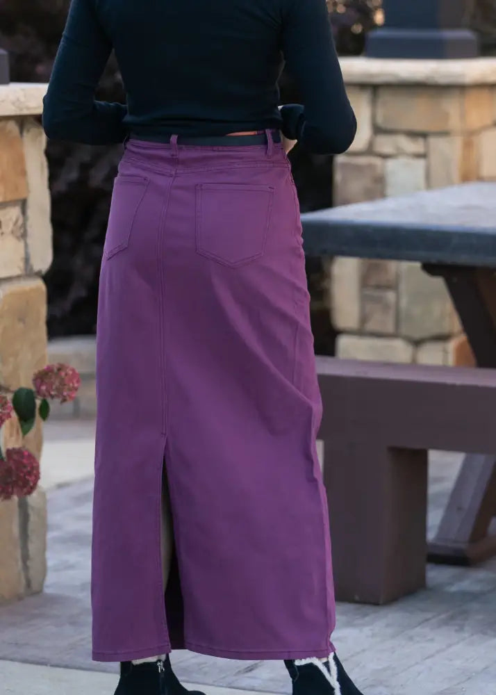 A deep purple mid-thigh denim skirt with front slit and back pockets from Stella Orchid high waisted collection