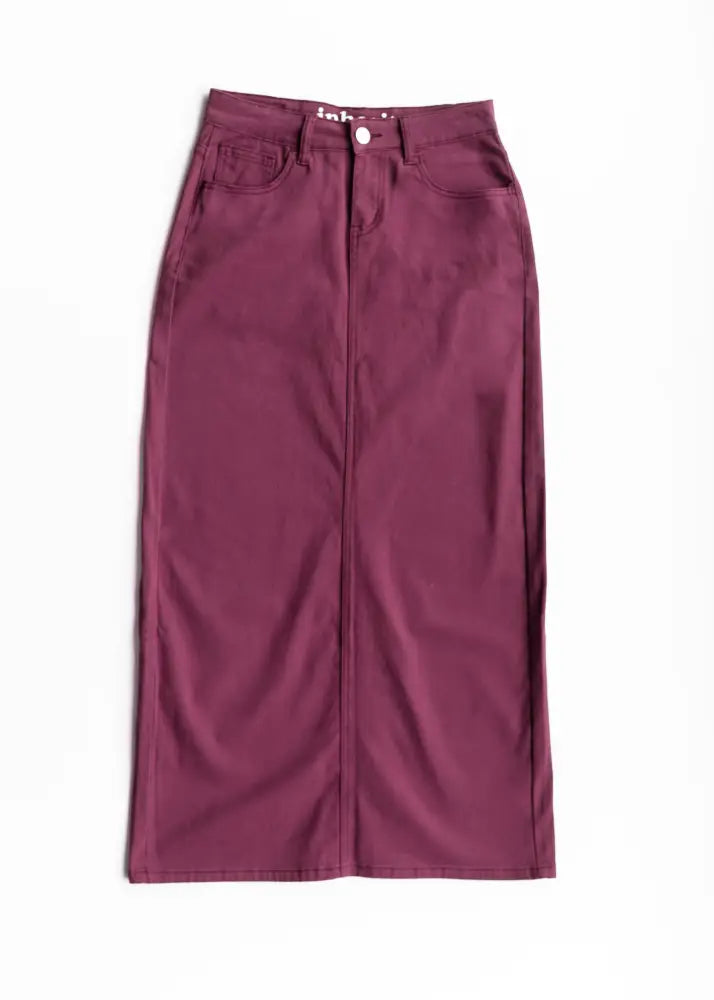 A maroon high waisted denim skirt with front zipper and button closure from Stella Orchid purple denim maxi collection