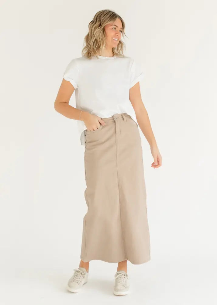 A beige Stella Simply taupe denim high waisted maxi skirt with wide legs, straight hem, and front pockets