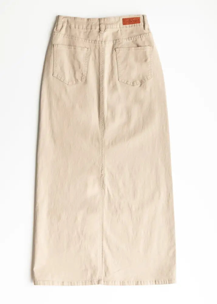 Beige denim midi skirt with back pockets and brown leather stella simply taupe brand patch shown from the back