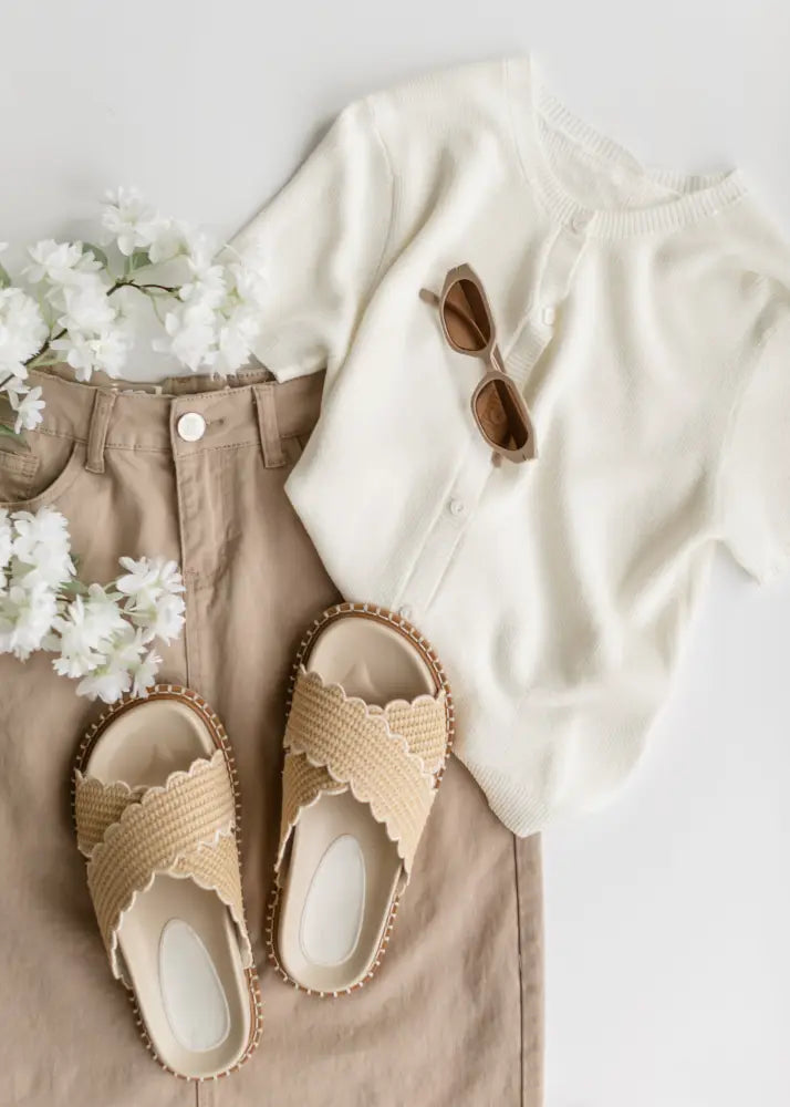 Beige woven sandals with scalloped edges and soft textured finish paired with stella simply taupe denim high waisted maxi skirt