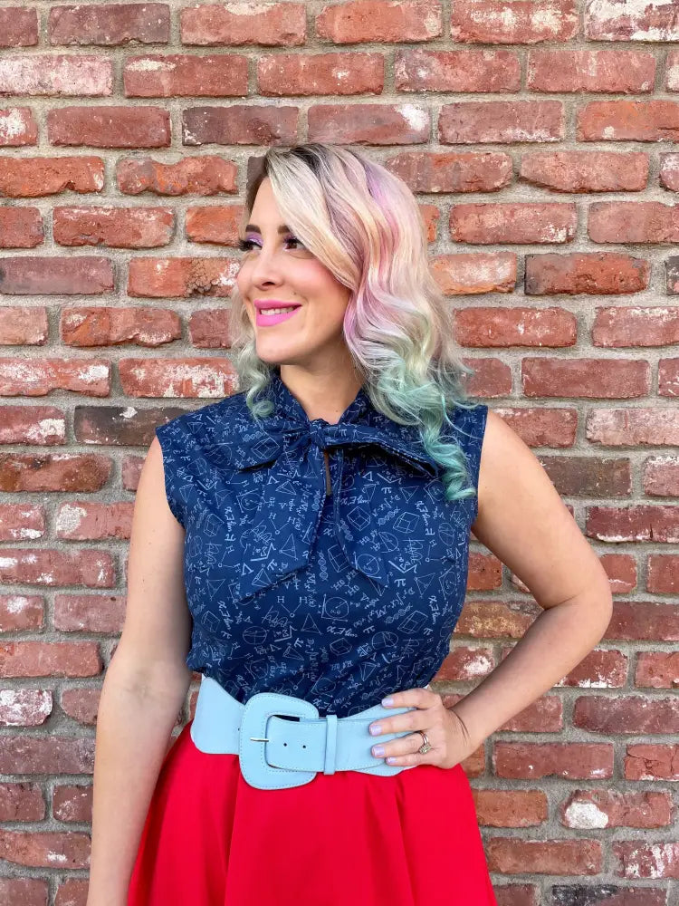 Stem print navy lace bow top with sleeveless design and mathematical symbols pattern on blue fabric