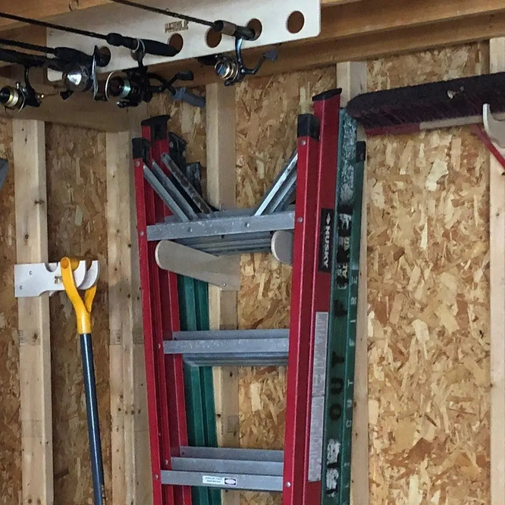 Heavy duty birch plywood dual step ladder wall rack holding a red and green axess extension ladder with silver rungs