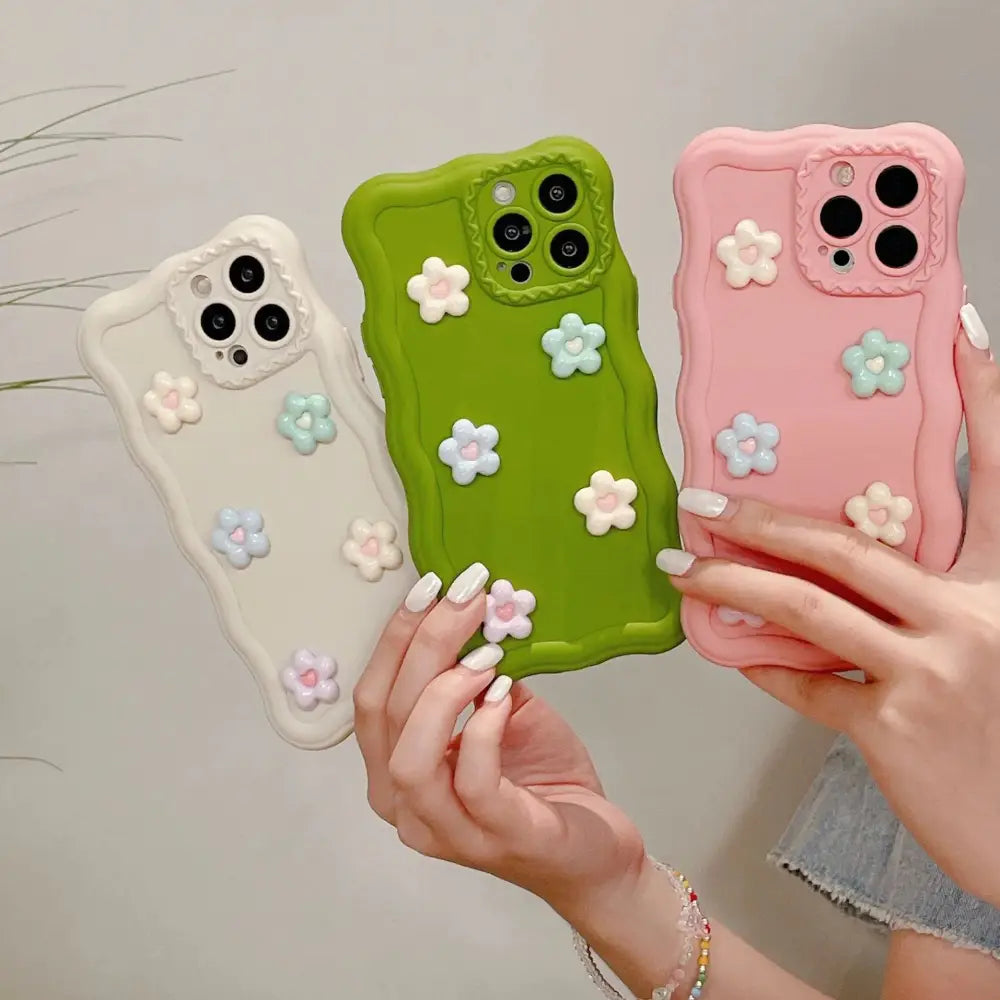Pastel-colored 3d floral textured silicone phone cases with soft silicone and raised flower embellishments shown from the back side