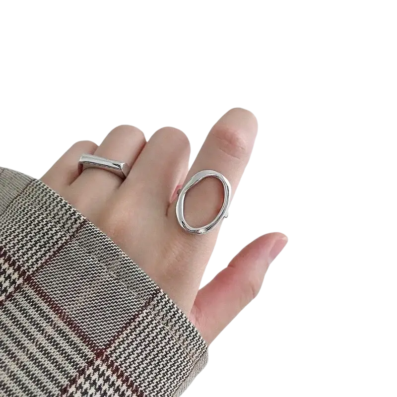 Sterling silver adjustable open oval ring with a sleek minimalist design worn on a finger
