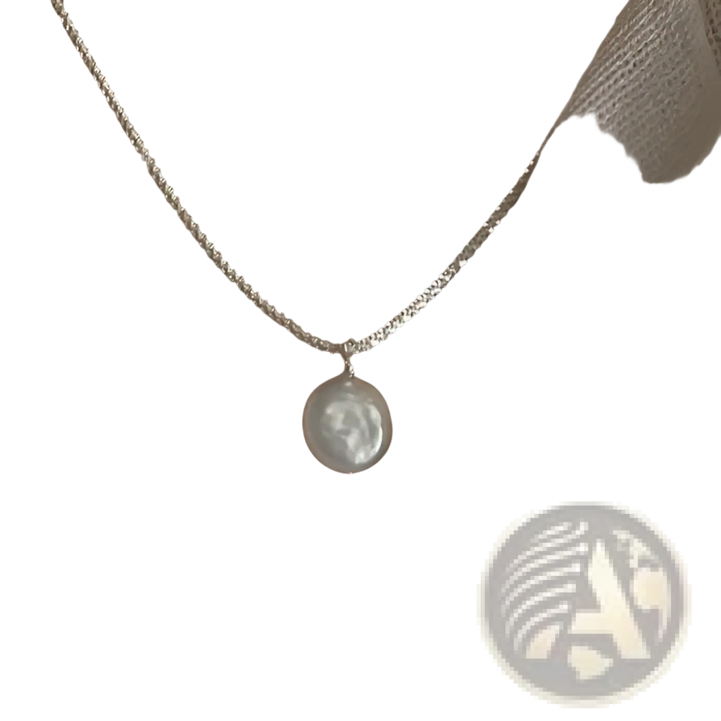 Sterling silver baroque pearl starry sky necklace with a delicate silver chain and a single white baroque pearl pendant