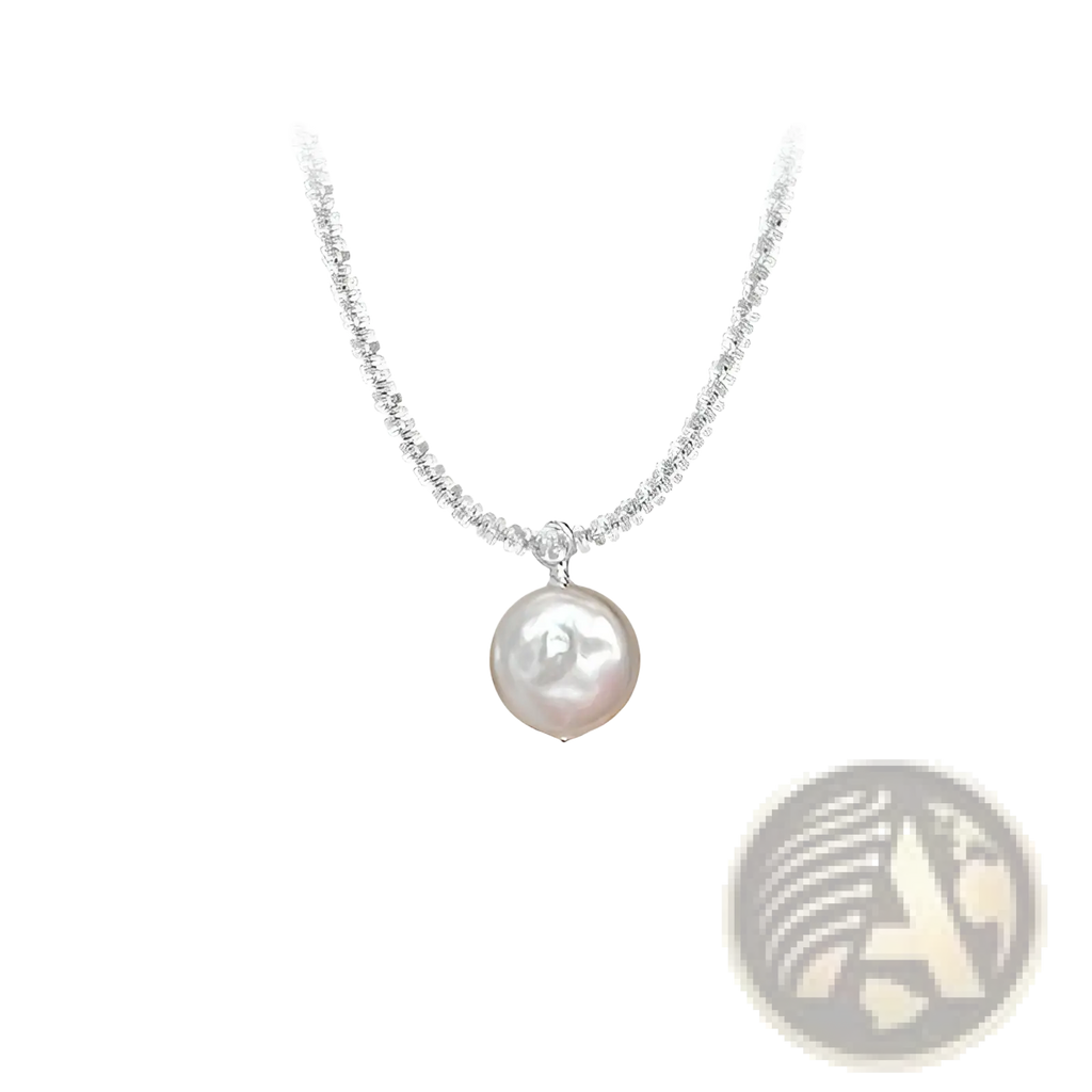 Sterling silver baroque pearl starry sky necklace with a delicate silver chain and a single off-white freshwater pearl pendant