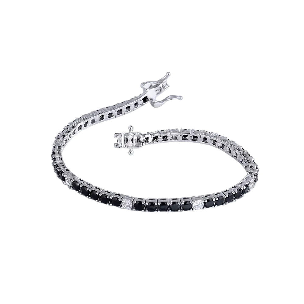 A sleek silver sterling silver black cz tennis bracelet 3mm with alternating black and clear stones and a polished clasp