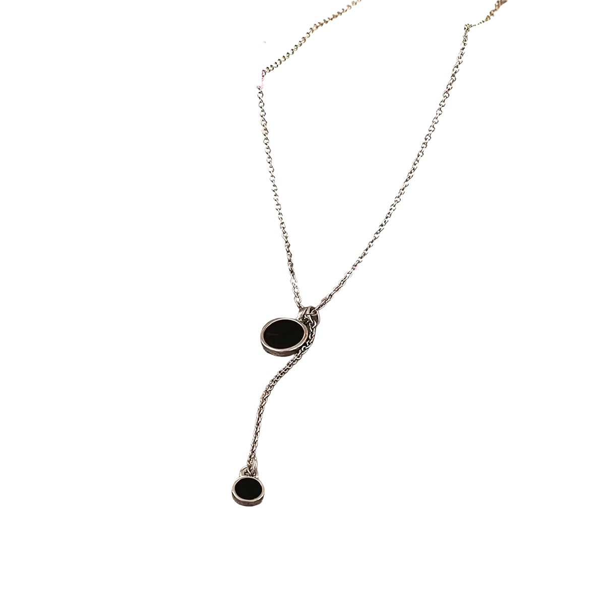 Sterling silver necklace with two black circular pendants featuring a delicate minimalist double circle design