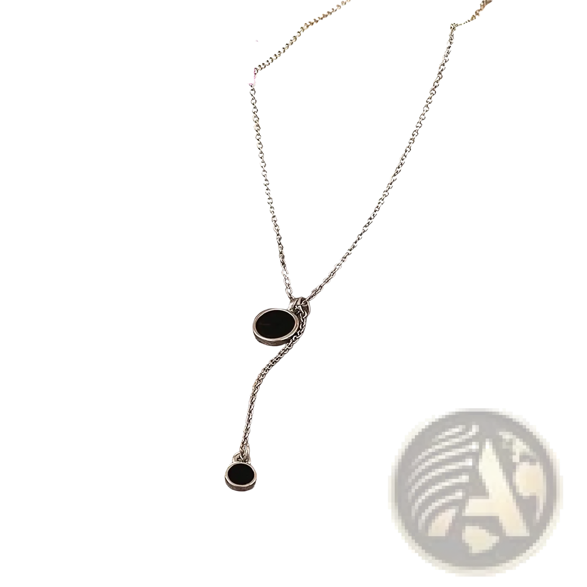 Sterling silver necklace with two black circular pendants featuring a delicate minimalist double circle design