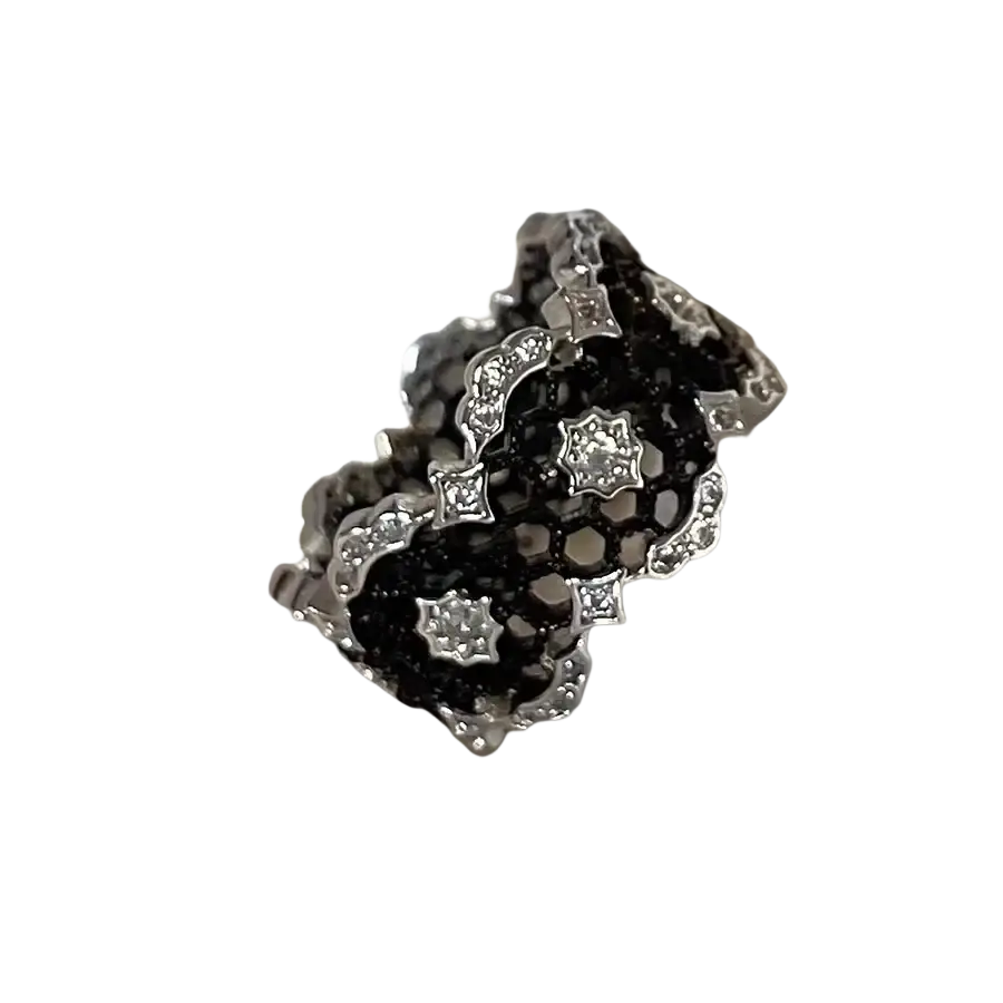 Sterling silver black geometric ring for women with an intricate lace-like design and embedded clear crystals