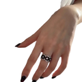 A patico sterling silver black geometric ring for women with a silver band, intricate floral pattern, and clear stones