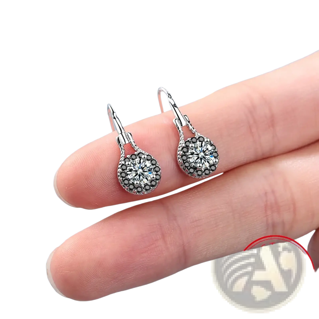Sterling silver black spinel dangle earrings with a central clear crystal and surrounding black crystals in a circular design