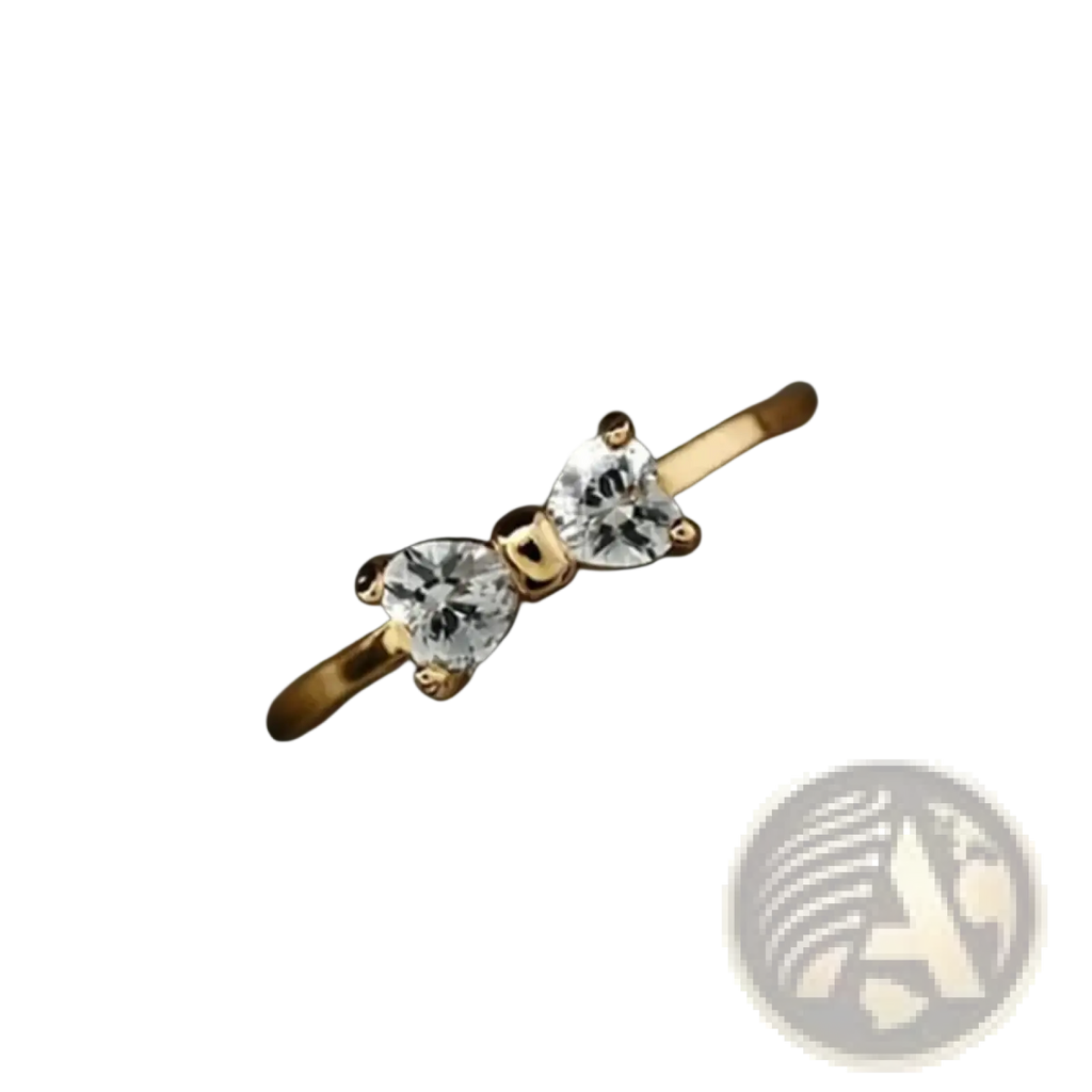 Sterling silver wedding band with gold-toned bow design featuring two heart-shaped cubic zirconia stones