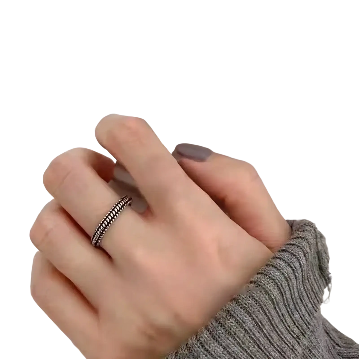 Sterling silver braided toe ring with a delicate textured design worn on a finger