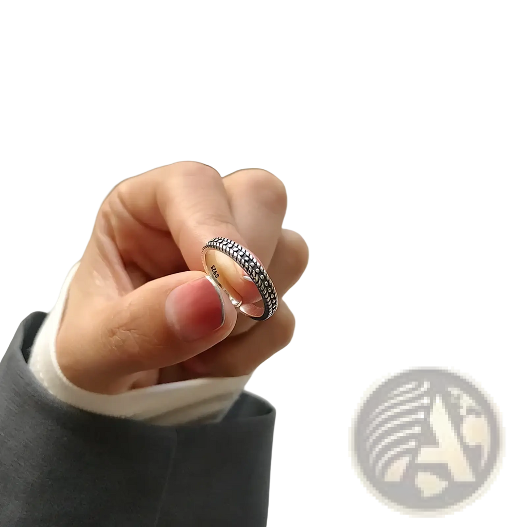 Sterling silver braided toe ring featuring a delicate band with an intricate textured pattern