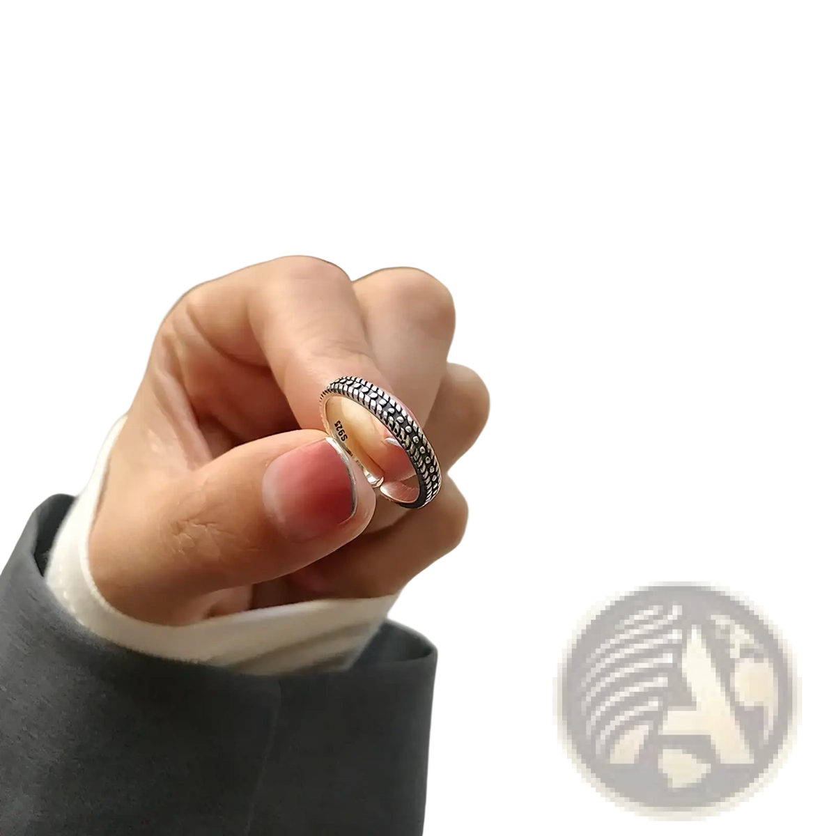 Sterling silver braided toe ring featuring a delicate band with an intricate textured pattern