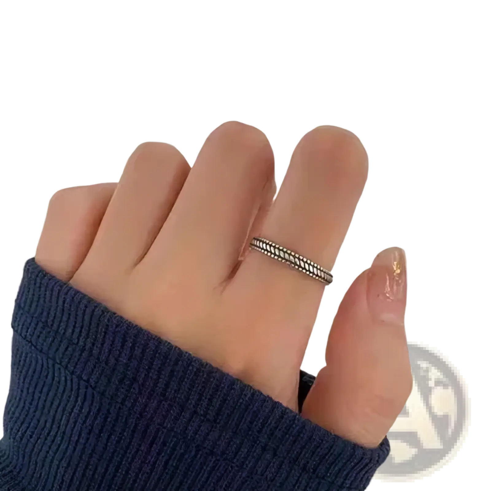 Sterling silver braided toe ring with delicate twisted design worn on a finger