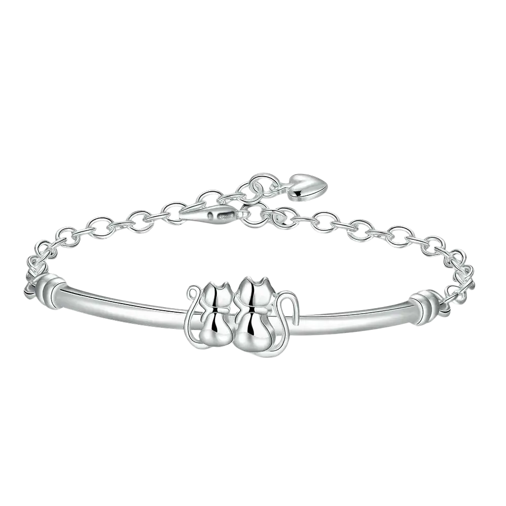 Sterling silver cat couple charm bracelet with two intricately designed cat figures on a polished band with chain closure