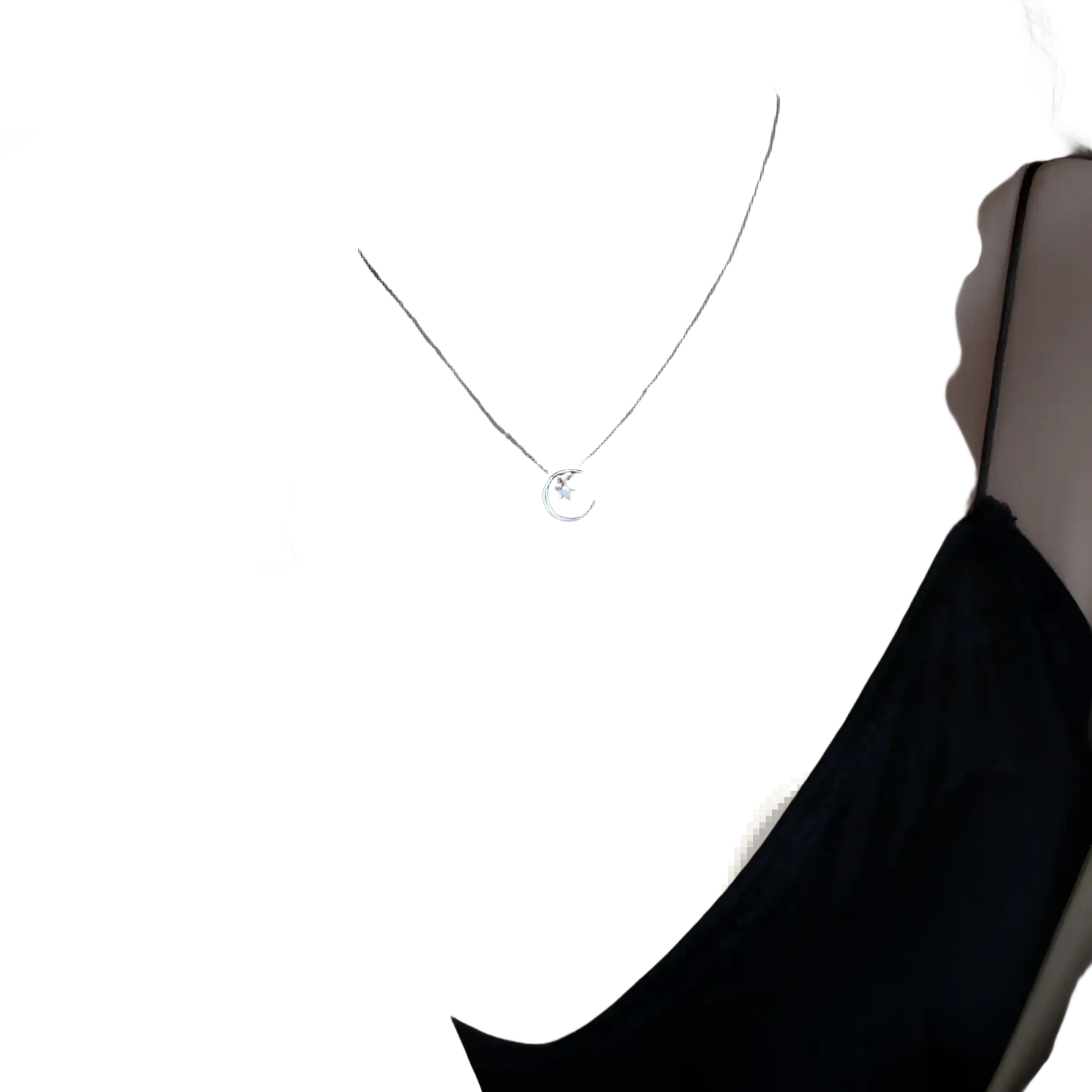 Sterling silver crescent moon and star pendant necklace featuring a delicate silver crescent with a small star center