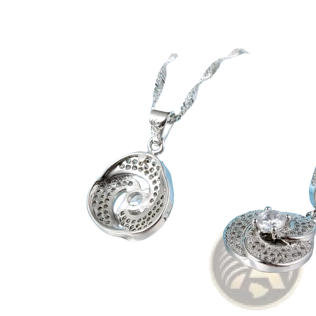 Sterling silver crystal bridal jewelry set featuring a silver spiral pendant necklace with clear crystals and delicate chain