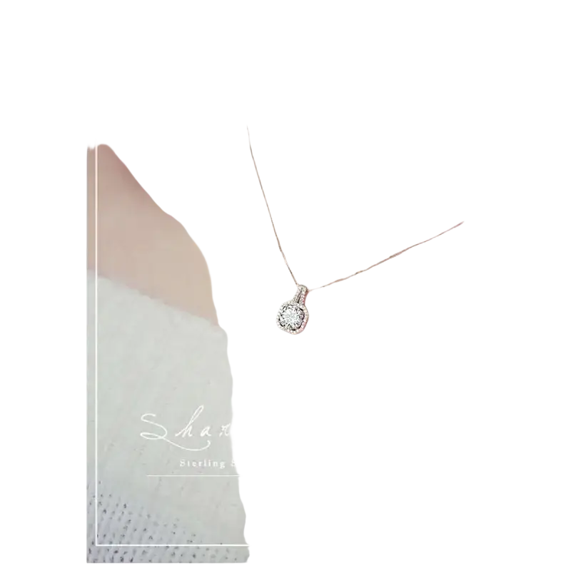Sterling silver cubic zirconia halo pendant necklace with square pendant featuring central and surrounding stones