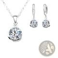 Sterling silver cz jewelry set with a silver-toned round pendant and matching hoop earrings with clear crystals