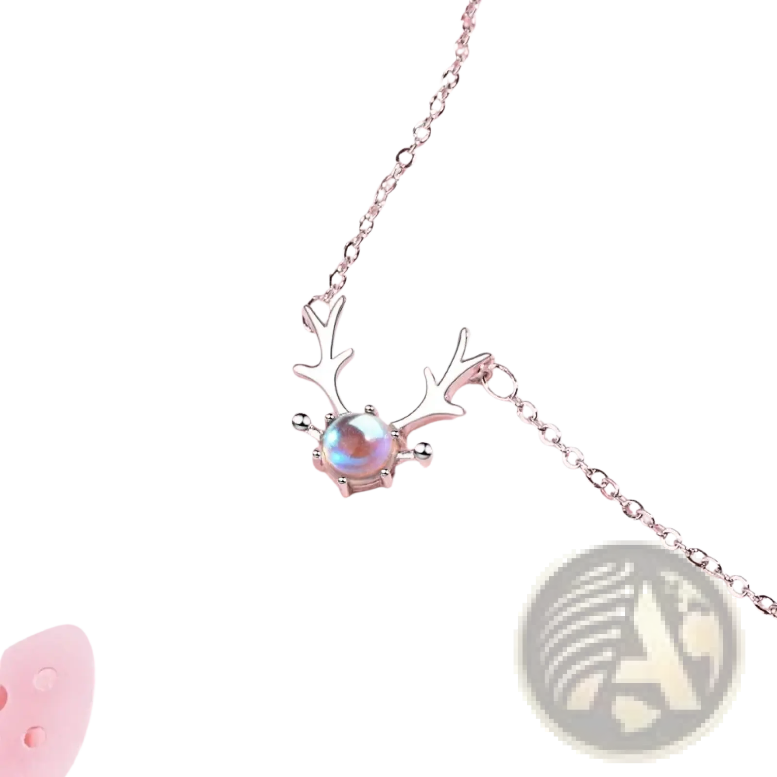 Sterling silver deer antler necklace featuring a central iridescent moonstone pendant in silver tone