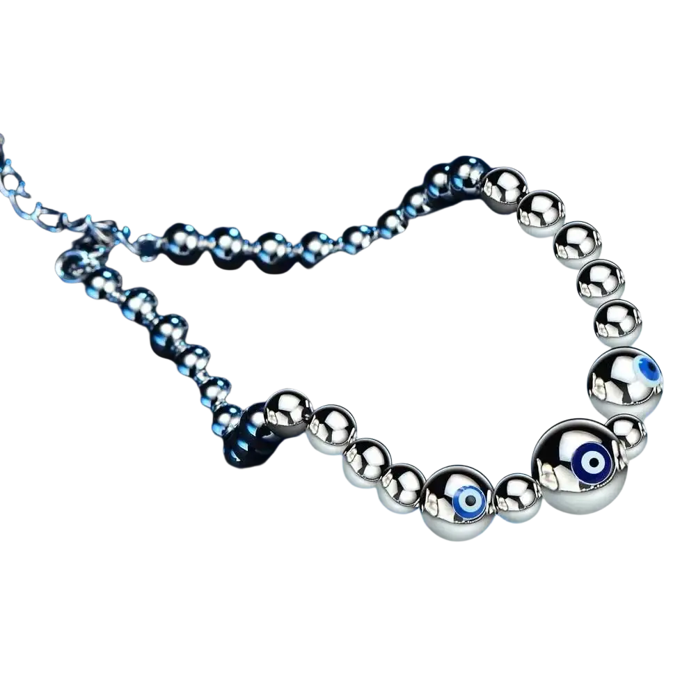 Sterling silver evil eye charm bracelet for women with polished silver beads and embedded blue evil eye charms