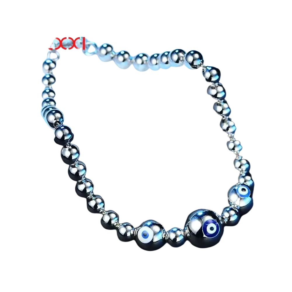 Sterling silver beaded bracelet for women with polished spheres and two blue evil eye charm accents