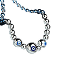 Sterling silver evil eye charm bracelet for women with polished silver beads and central blue evil eye design